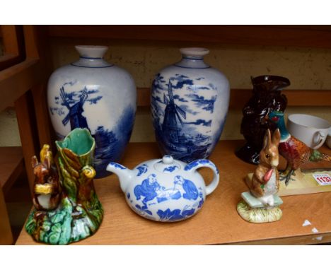 A mixed lot of pottery and porcelain, to include: a Beswick pheasant; a majolica squirrel spill vase; and a Shelley cup and s