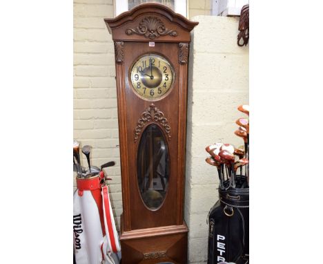 A 1920s oak longcase clock, 192cm high.