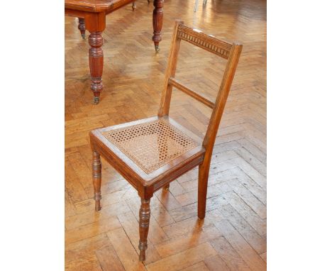 A pair of bedroom chairs with cane seats, on turned bobbin supports 