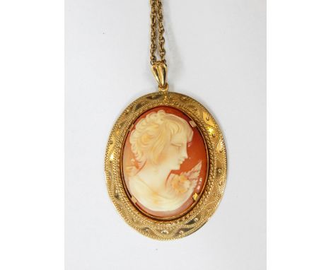 A carved shell cameo pendant, female allegorical portrait in 9ct gold mount with bright cut type decoration, suspended on a 9