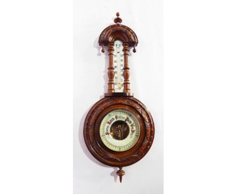 Carved walnut barometer with turned finials and arched top, 55cm long 