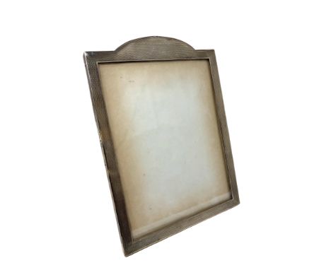 A George V silver easel photograph frame with engine turned decoration, Horton &amp; Allday, Birmingham 1915, height 22cm. 