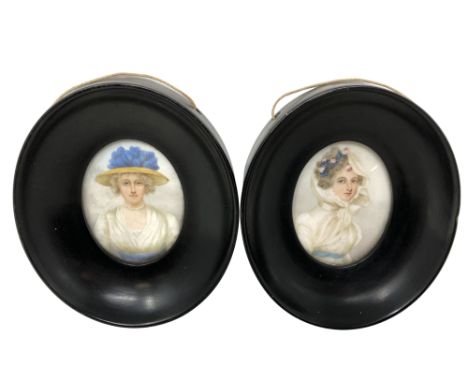 Two 19th century portrait miniatures on ivory, each depicting a lady wearing a white dress with blue belt.  Each inscribed ve