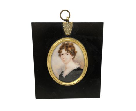 An early 19th century portrait miniature depicting a lady in black dress, 5 cm x 6.5 cm, framed. CONDITION REPORT: Unexamined