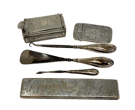 An engraved silver dressing table pot lid, another silver lidded glass box, a silver-mounted shoe horn, nail pick and button 