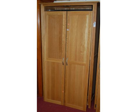 A contemporary light oak double door wardrobe, width 110cm