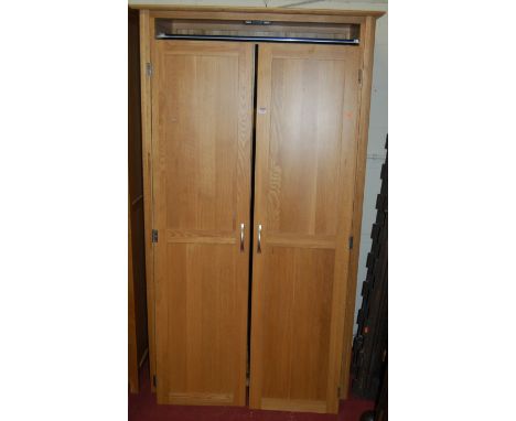 A contemporary light oak double door wardrobe, width 110cm