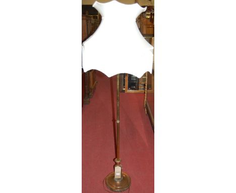An early 20th century brass and copper standard lamp