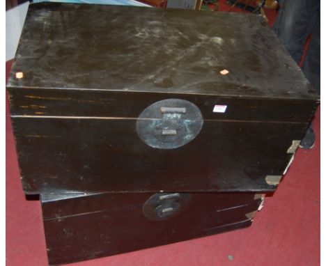 A modern Chinese black lacquered unfitted trunk; and one other slightly larger example (2) 