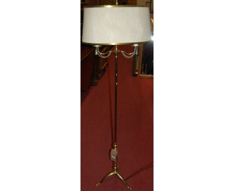 An early 20th century brass two light standard lamp
