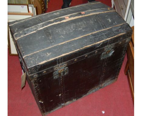 A metal bound black canvas dome-top trunk  