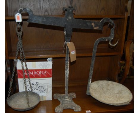 A set of early 20th century cast iron weighing scales