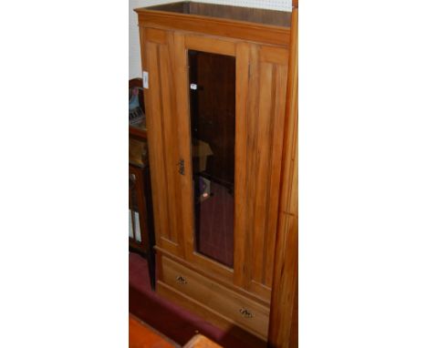 An Edwardian satin walnut single mirror door wardrobe having single long lower drawer, width 95cm