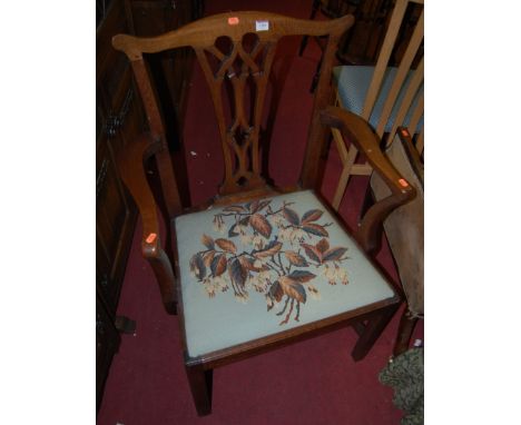 A 19th century oak Chippendale style elbow chair, having tapestry upholstered drop-in padseat 