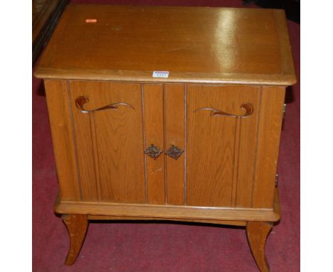 An early 20th century light oak double door bedside cupboard, width 54cm