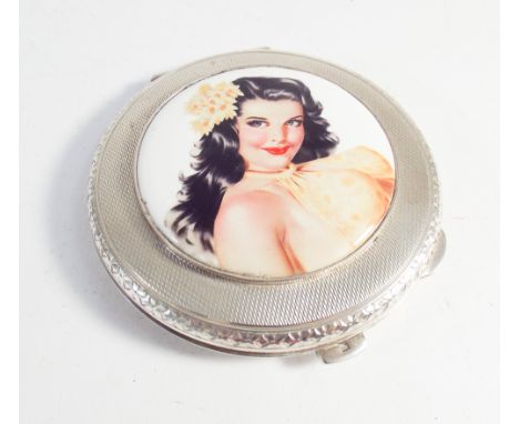 Hallmarked silver circular engine turned compact the lid decorated with applied enamel of a varga girl 