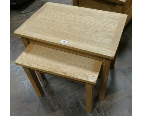 Nest of two light oak coffee tables matching the previous lot 
