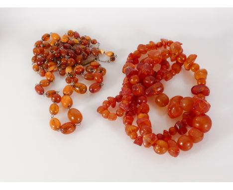 A double row of vintage amber beads and a longer row of amber nugget style beads. Gross weight of double row 22 grams approx,