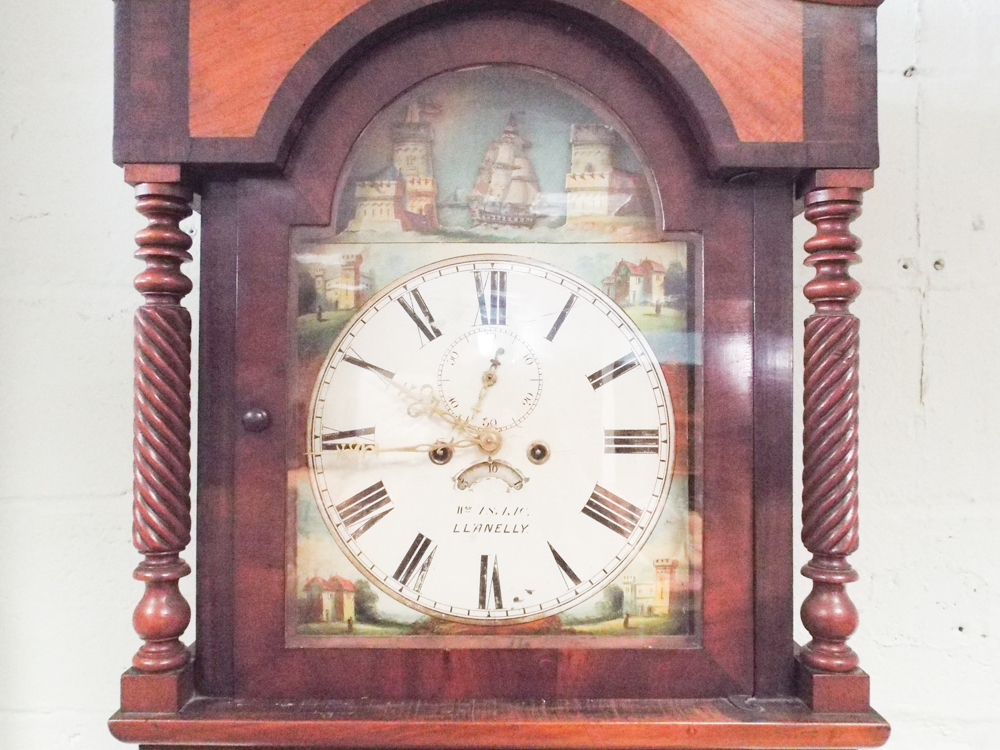 19th century grandfather clock in mahogany case with painted arched