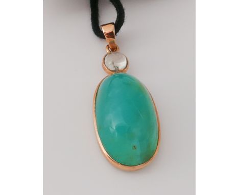 Modern oval jade pendant with moonstone top, in a gold (unmarked) setting.