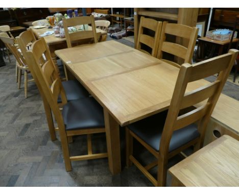 New light oak extending dining table with centre leaf and 6 matching ladder back chairs with brown upholstered seats 