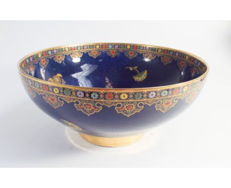 Carlton ware fruitbowl decorated with Oriental style design on a blue ground, 25cm across 