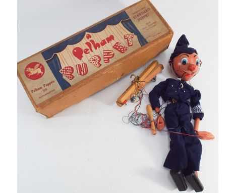 Old collectable Pelham Puppet - the Policeman with box 