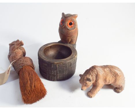 Collection of Black Forest treenware to include bear, table sweep, owl ashtray and a small carved model of a bear 