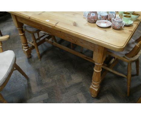 Modern light pine farmhouse dining table on turned legs with  cross stretcher 5' x 3'