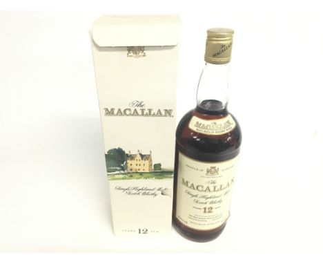 A 1980s 1 liter bottle of 12 year old MacAllan single highland malt scotch whisky in box.