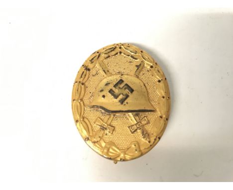 WW2 Spanish Civil War Period German Condor Legion Wound Badge. The badge being a voided gold 1st Class example depicting a Ge