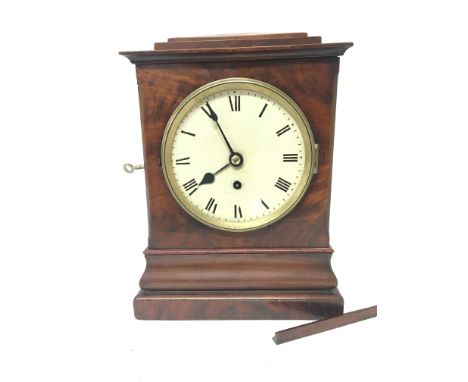 An Early Victorian Mahogany cased mantel or bracket clock with a white dial and single brass fusee movement with pendulum. He
