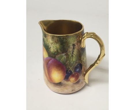 A Quality hand painted Royal Worcester jug decorated with fruit and foliage signed by the artist John Freeman. With a rich gi