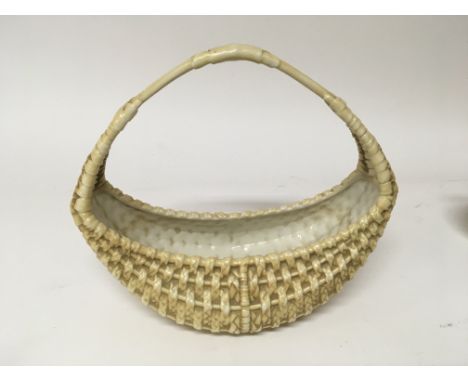 A Royal Worcester porcelain basket no obvious damage. Height 20cm.