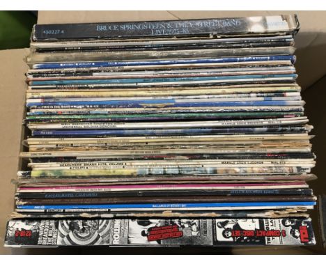 A collection of LPs by various artists including Bruce Springsteen, The Kinks, Eric Clapton and a Rolling Stones London Years