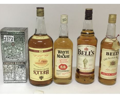 Five bottles of scotch Whisky a twelve year chivas Regal Bells and a bottle of Whyte &amp; Mackay (5)