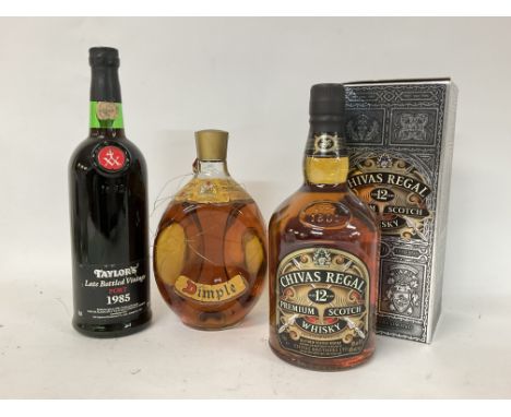 A bottle of vintage Dimple, vintage Taylors 1985 port and Chivas Regal Premium scotch whiskey boxed