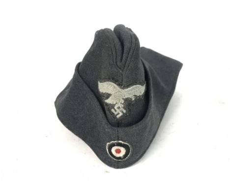 WW2 German Luftwaffe Enlisted Mans/NCO's Side Cap. The cap with embroidered roundel and Luftwaffe Eagle clutching a Swastika 