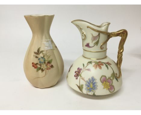 A Royal Worcester porcelain jug decorated with flowers and gilt handle and one other Worcester vase height 14cm (2)