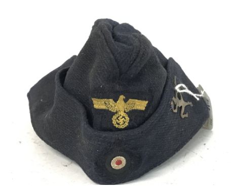 WW2 German Kriegsmarine 7th Flotilla Side Cap. Blue wool construction with front cockade roundel, Eagle Swastika patch and Re