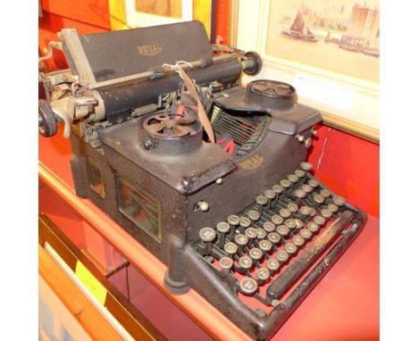A vintage Royal typewriter and a set of grocery scales (2)