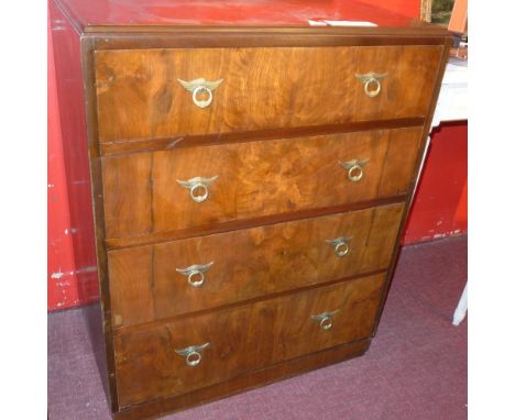 An Art Deco walnut chest fitted four drawers with brass handles on plinth base