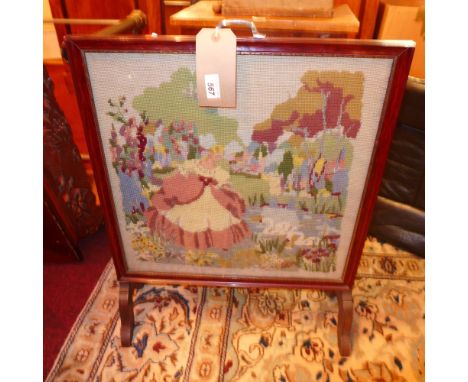 A collection of brass and copper warming pans and a tapestry fire screen 