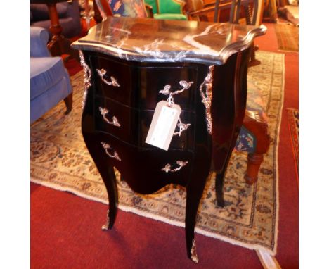 A contemporary design French Louis XVI ebonised petite bombe commode, the black marble top over three drawers raised on splay