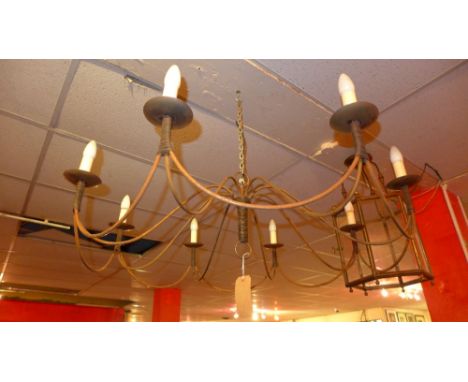 A large wrought iron eight branch chandelier 