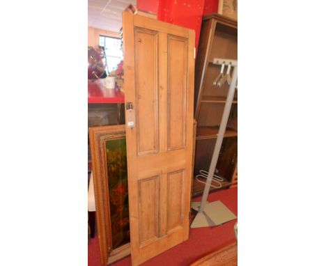 A vintage pine door of panelled construction 57 x 181cm 