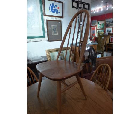 A set of six 1960s Ercol light elm dining chairs with solid seats on stretchered supports 