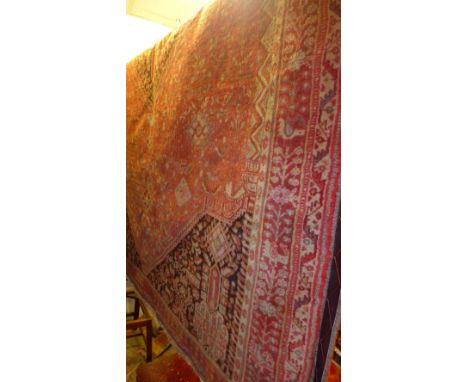 An extremely fine south west Persian Qashgai carpet 245 x 163cm central diamond medallion with repeating petal and animal mot