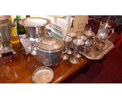 A large collection of silver plated items including a wine cooler, an ice bucket, a four piece tea and coffee set and other i