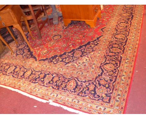 A fine central Persian Kashan carpet 372 x 252cm central double pendent medallion with repeating spandrels on a rouge field w